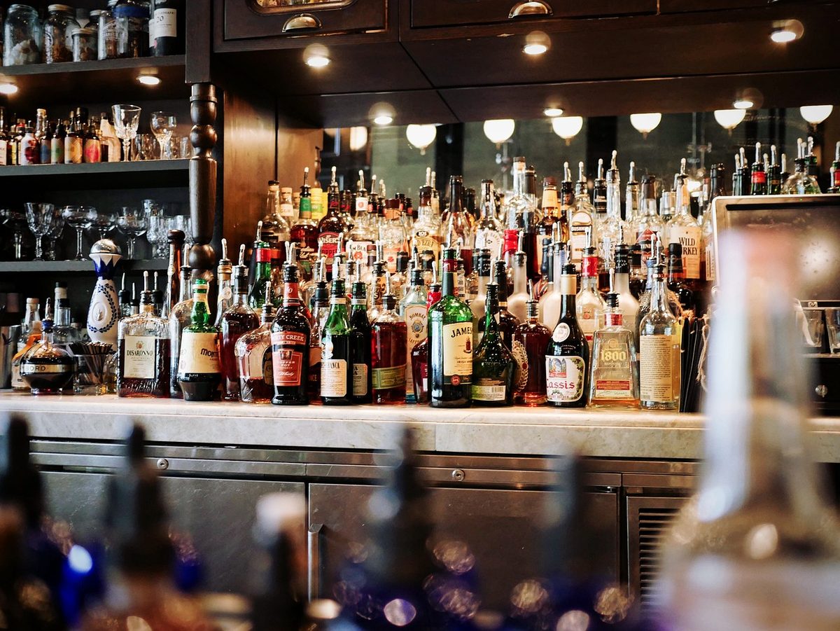Back bar shelves lined with liquor bottles (Florida bar and tavern insurance)